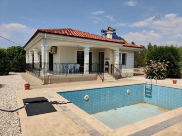 A Ready-To-Move Fethiye Bungalow For Sale - Main view of the bungalow with private pool and garden