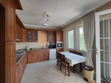 A Ready-To-Move Fethiye Bungalow For Sale - Kitchen with built-in white goods