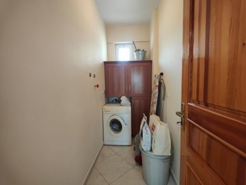 A Ready-To-Move Fethiye Bungalow For Sale - Convenient utility room with washing machine