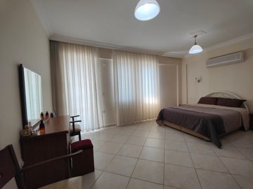 A Ready-To-Move Fethiye Bungalow For Sale - A large furnished master bedroom