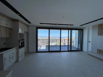 Sea View Kusadasi Apartments with A Pool & Smart-Home System Are For Sale - Floor-to-ceiling windows with sea views