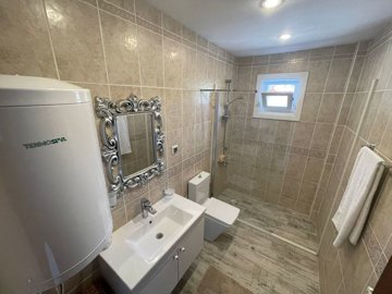 Ready-To-Move Uzumlu Stone Bungalow For Sale - Luxurious bathroom with high-quality units and accessories