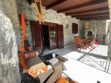 Ready-To-Move Uzumlu Stone Bungalow For Sale - Covered terrace and entrance to bungalow