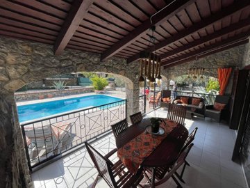 Ready-To-Move Uzumlu Stone Bungalow For Sale - Shady terrace for dining