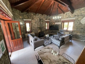 Ready-To-Move Uzumlu Stone Bungalow For Sale - Lounge space with beamed ceilings