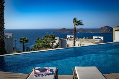 Superb Hillside Apartment For Sale In Bodrum - Communal pool with magical sea views and sunbathing terraces