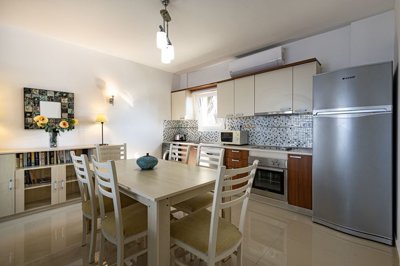 Superb Hillside Apartment For Sale In Bodrum - Dining area through to the kitchen