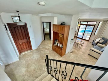 A Traditional Detached Stone Villa For Sale In Fethiye - View to the living space from the staircase