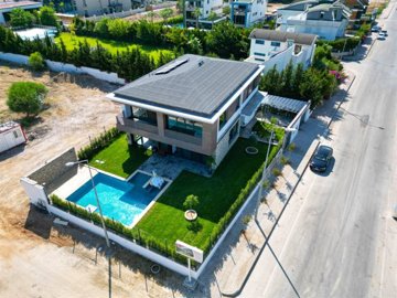 An Ultra-Modern Villa With A Private Pool For Sale in Belek, Antalya - Arial view over the entire property and gardens