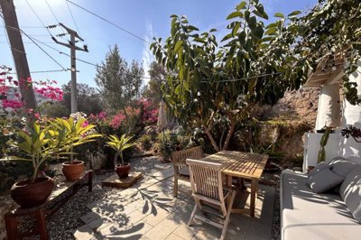 A Unique Coastal Stone House For Sale In Bodrum - A private garden full of colour