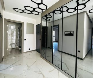 A Trendy Ground-Floor Apartment For Sale In Kusadasi - Entrance hallway with fitted cupboards