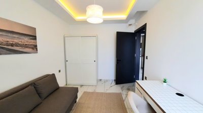 A Modern Apartment For Sale in Mahmutlar, Alanya - Bedroom with storage space