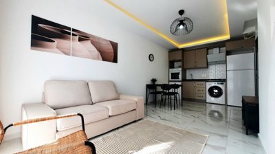 A Modern Apartment For Sale in Mahmutlar, Alanya - Living and kitchen area