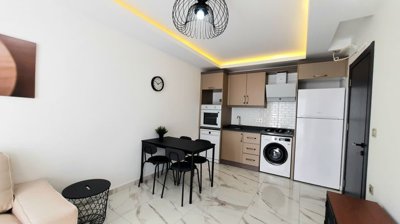 A Modern Apartment For Sale in Mahmutlar, Alanya - A bright space with ambient lighting