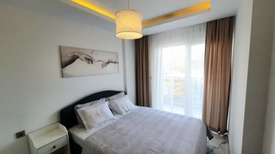 A Modern Apartment For Sale in Mahmutlar, Alanya - First bedroom with balcony