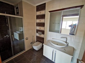 A Sea View Kusadasi Duplex Apartment For Sale With On-Site Facilities - Ensuite shower room in the master bedroom