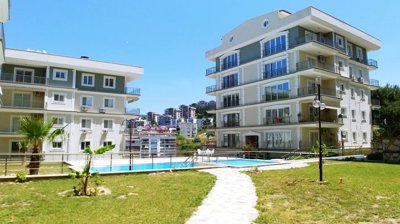 A Sea View Kusadasi Duplex Apartment For Sale With On-Site Facilities - Landscaped social gardens