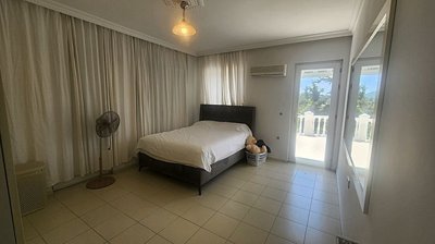 A Grand Detached Villa In Fethiye For Sale - A good-sized bedroom with balcony