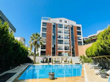 An Impressive Modern Kusadasi Apartment For Sale - Main view of the apartment complex and pool