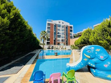 An Impressive Modern Kusadasi Apartment For Sale - A modern block with communal pool and kids pool