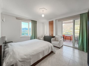 A Modern, Fully Furnished Property For Sale In Alanya – Double bedroom featuring a balcony