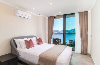 A High-End Sea-View Villa In Kalkan For Sale - Double bedroom with balcony and sea views