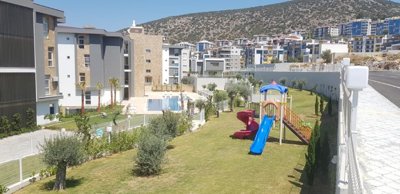 Modern Apartment Near The Beach In Kusadasi For Sale - Landscaped gardens and kids play ground