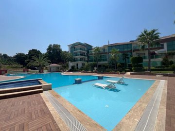 A Sea & Nature View Alanya Duplex Apartment For Sale In Kargicak - Main view of the complexes pool and sun terraces