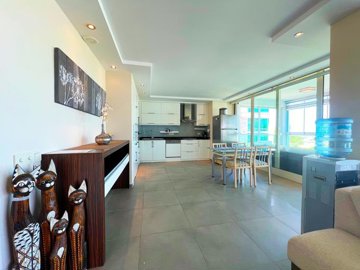 A Sea & Nature View Alanya Duplex Apartment For Sale In Kargicak - Lounge through to the kitchen