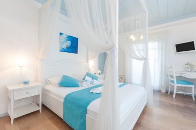 Idyllic Boutique Hotel For Sale In Alacati - Bright and airy bedrooms with ensuite bathrooms