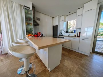 Serene Yalikavak Sea View Villa For Sale – A modern kitchen with a breakfast bar