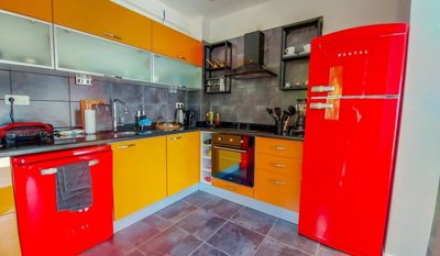 An Incredible Sea View Villa For Sale In Yalikavak – A funky kitchen with built-in white goods and stylish appliances