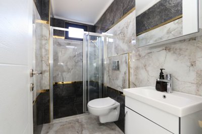 Spacious 2-Bedroom Apartment For Sale In Alanya - Ensuite shower room from the first bedroom