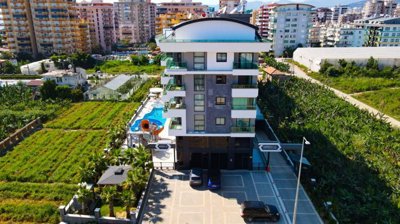 Spacious 2-Bedroom Apartment For Sale In Alanya - Lush green surroundings