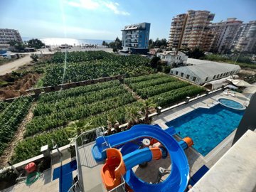 Spacious 2-Bedroom Apartment For Sale In Alanya - Living space balcony with sea and surrounding views