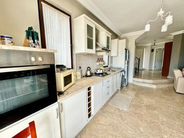 A Detached Villa For Sale In Seydikemer, Fethiye - Kitchen featuring built-in white goods and appliances