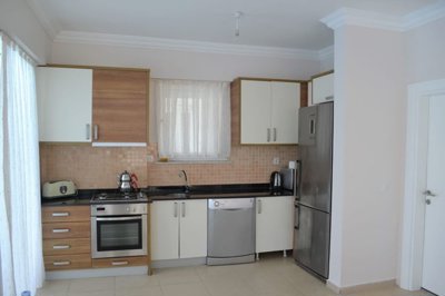 A Modern Triplex Villa For Sale in Belek, Antalya - Modern kitchen with built-in white goods