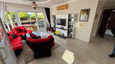 A Ready To Move Apartment In Antalya For Sale - An open-plan living space with access to a large balcony