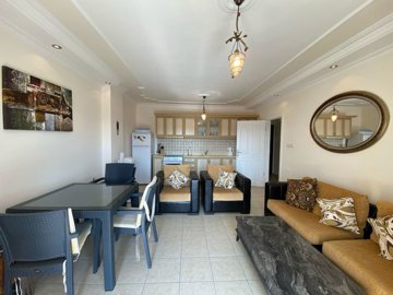 A Sea View Duplex Apartment In Didim For sale - Lounge through to the fully fitted kitchen