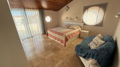 Duplex Investment Property In Belek For Sale - Slanted wooden ceilings in the master bedroom