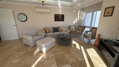 Duplex Investment Property In Belek For Sale - A beautifully furnished lounge with balcony access