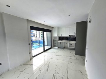 Alanya Apartment For Sale In Kargicak - View to the open-plan kitchen from the lounge area