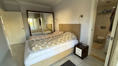 Ground Floor Apartment In Belek, Antalya For Sale - First bedroom, furnished as a twin with an ensuite shower room