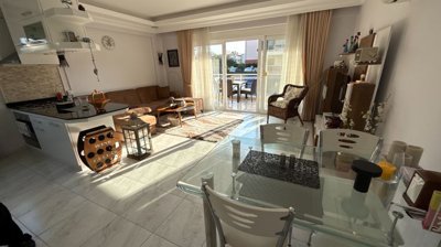 Ground Floor Apartment In Belek, Antalya For Sale - A sun-drenched living space with balcony