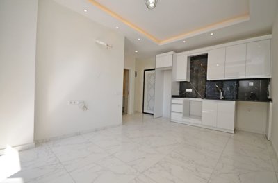 Modern Alanya One-Bedroom Property For Sale – View into the living space and kitchen