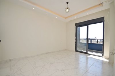 Modern Alanya One-Bedroom Property For Sale – Lounge area with a balcony