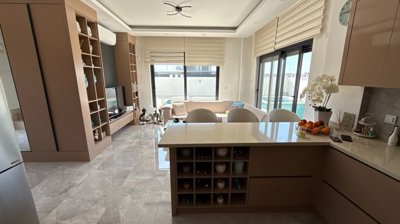 A Desirable Twin Villa For Sale in Antalya - Breakfast bar for dining and extra storage