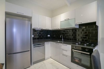 Ready To Move Duplex Apartment In Kestel, Alanya - A stylish fully fitted kitchen with built-in appliances