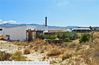 Rear and side of the warehouse and land