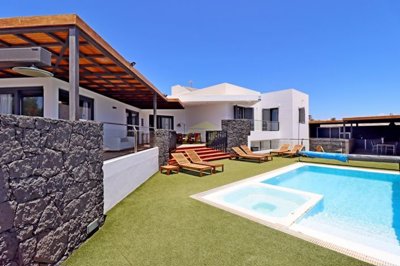 Luxury designer villa with 4 bedrooms, 4 bathrooms, games room, private heated pool and jacuzzi with sea views